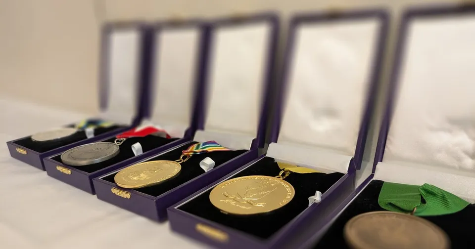 The STEM for Britain medals in their cases